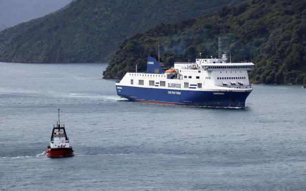 Bluebridge ferry the Connemara berthing at Picton wharf, helped by a tug, after earlier hitting the wharf while attempting to berth.